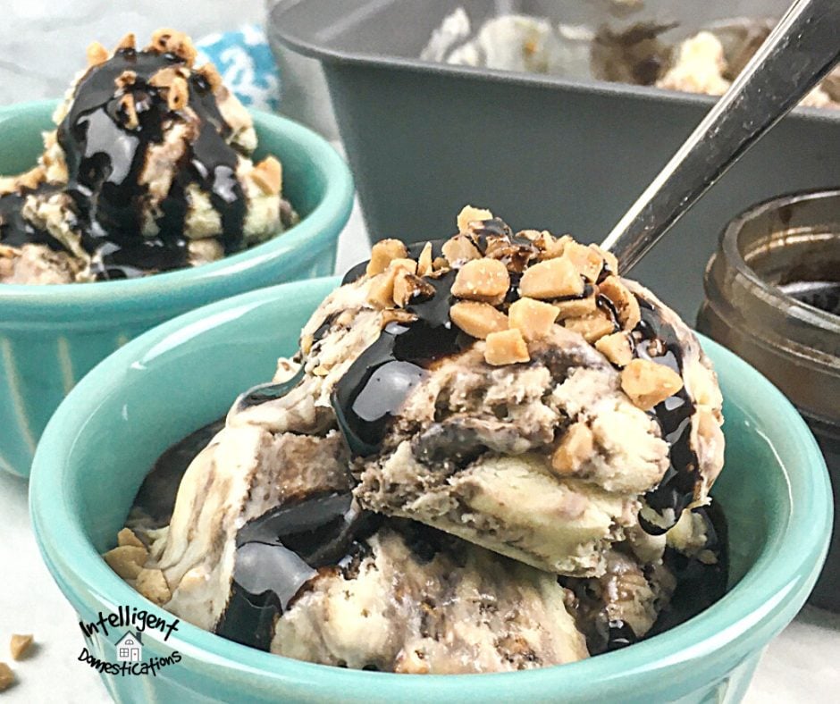 Ice Cream in a bowl with toffee bits and chocolate and toffee bits drizzled on top