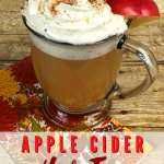 A cup of Hot Apple Cider tea with whipped cream on top