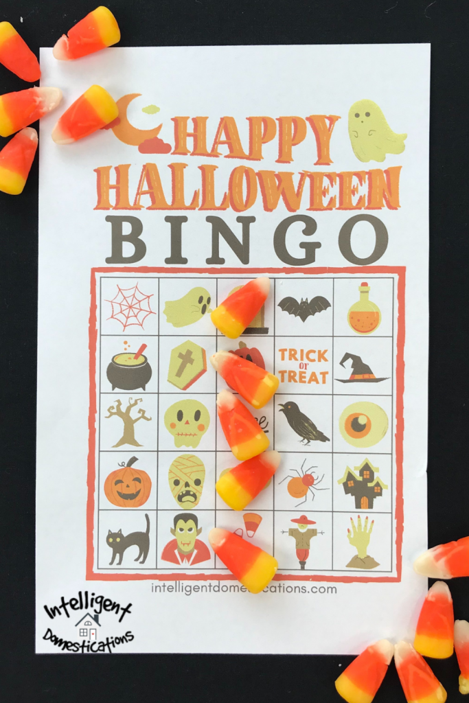 A Halloween BINGO card with candy corn on it