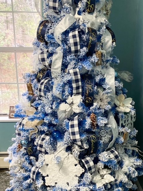 Image for How To Add Ribbon To A Beautiful Blue Flocked Christmas Tree