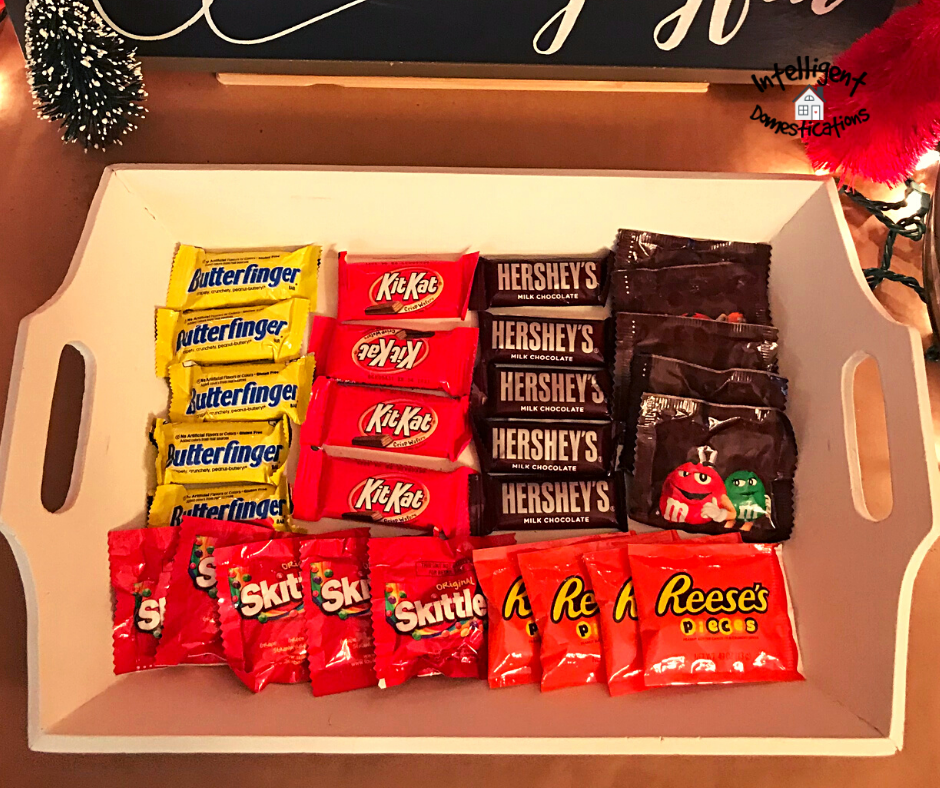 individual packages of candy displayed in a white tray