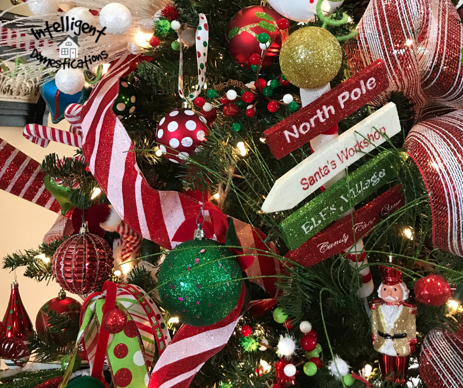 Red and white polka dot ball ornament on a Christmas tree