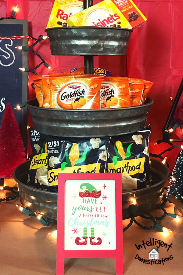 Three tier tray filled with snacks for movie night
