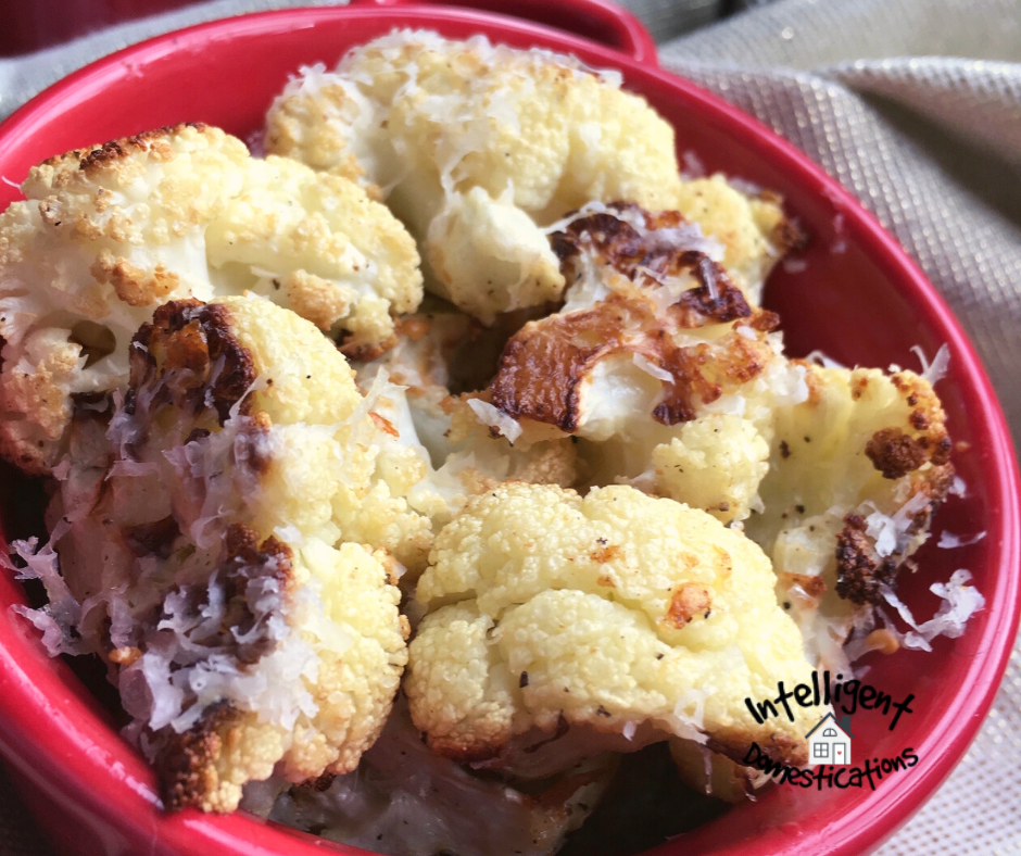 Cheesy Roasted Cauliflower in a red bowl