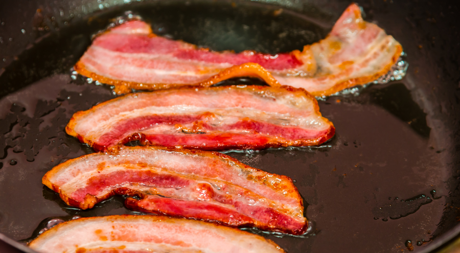 Bacon frying in a skillet