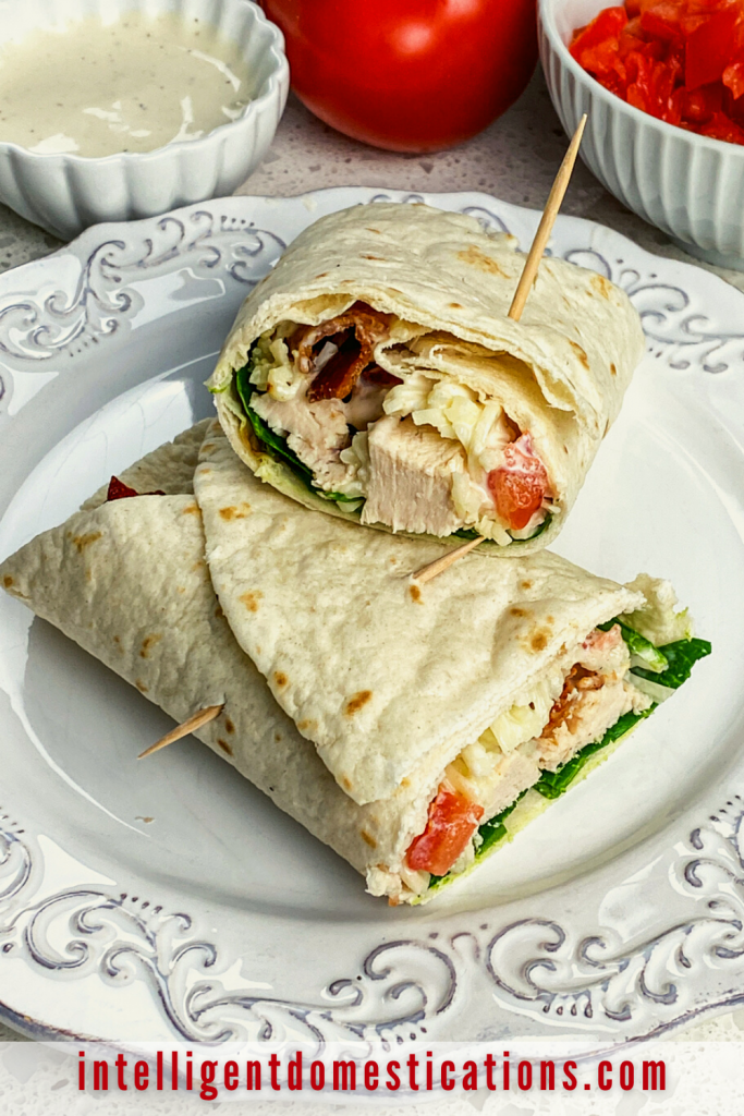 Chicken Bacon Ranch Wrap sliced in half on a white plate