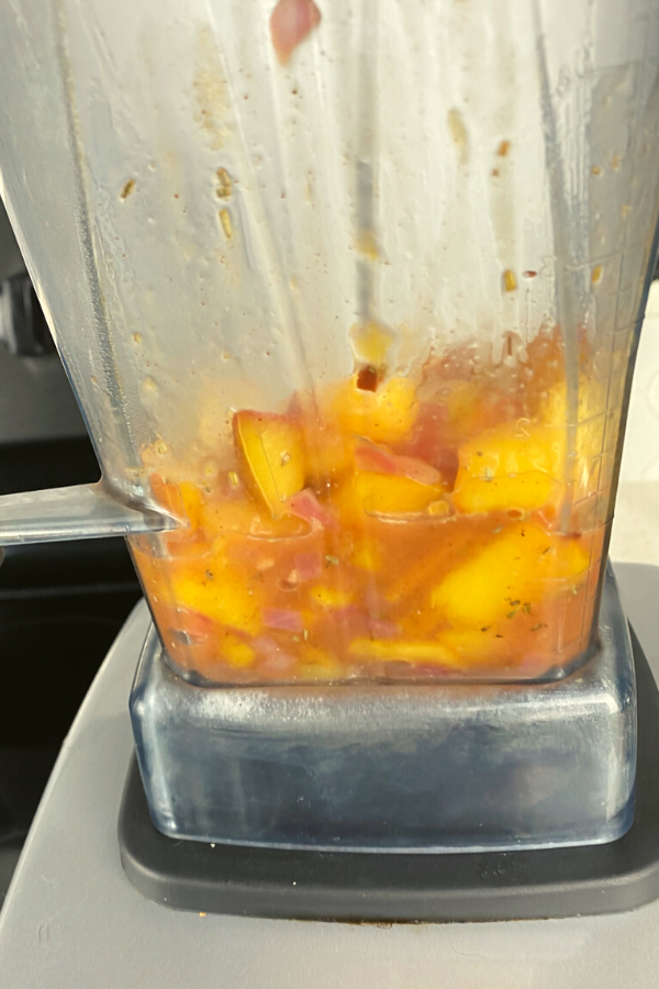 Peach compote mixture in a blender