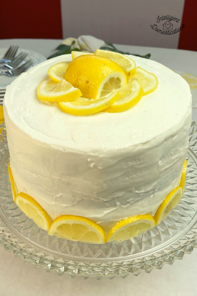 Round three layer Lemon Cake decorated with lemons
