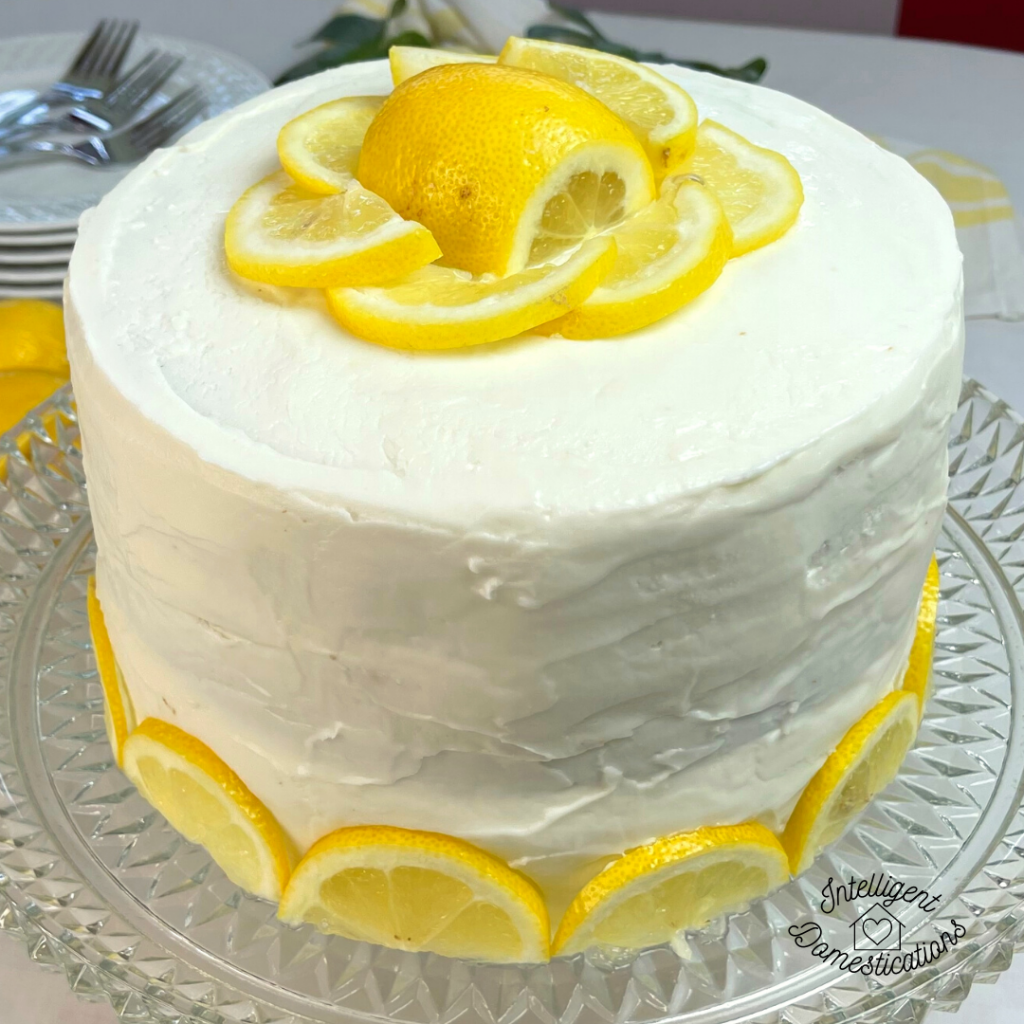 lemon layer cake decorated with cut lemons