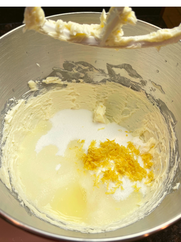 adding sugar, lemon juice and lemon peel to mixing bowl