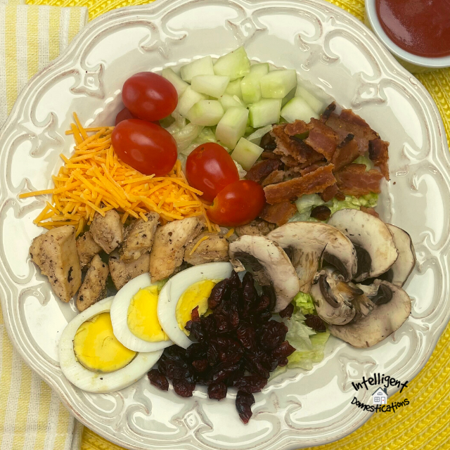 chef salad on a white plate
