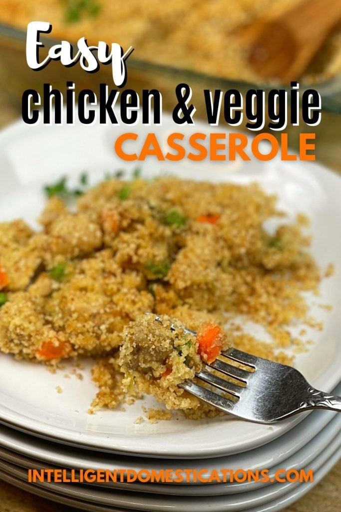 chicken casserole with peas and carrots on a white dish