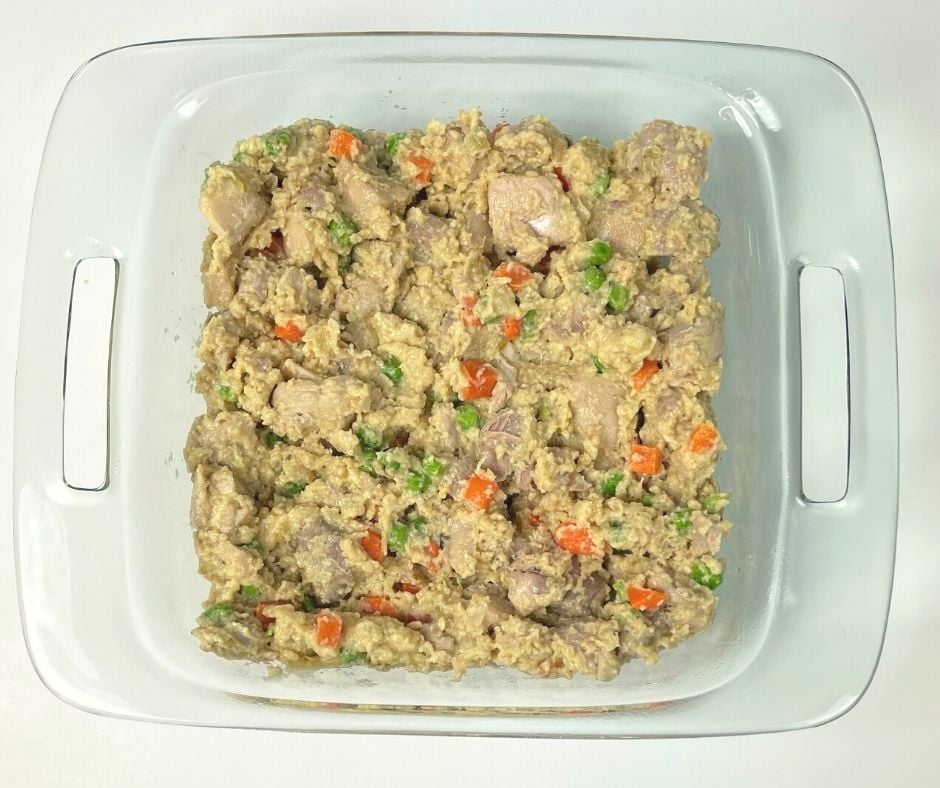 chicken and veggie casserole ready for the crust and oven