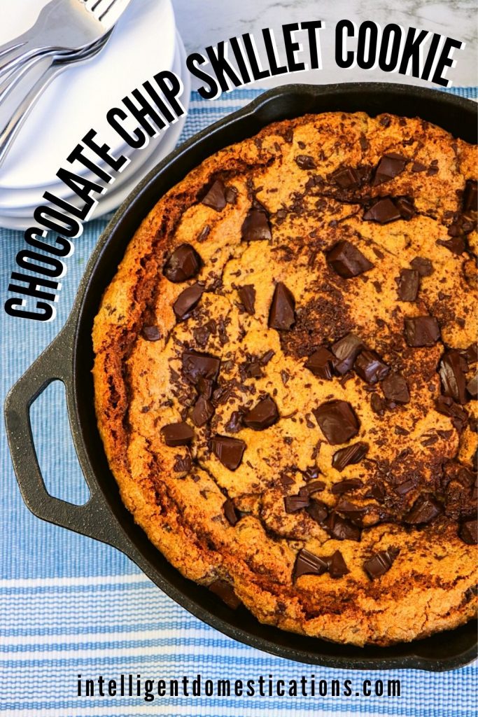 a giant chocolate chip cookie in an iron skillet