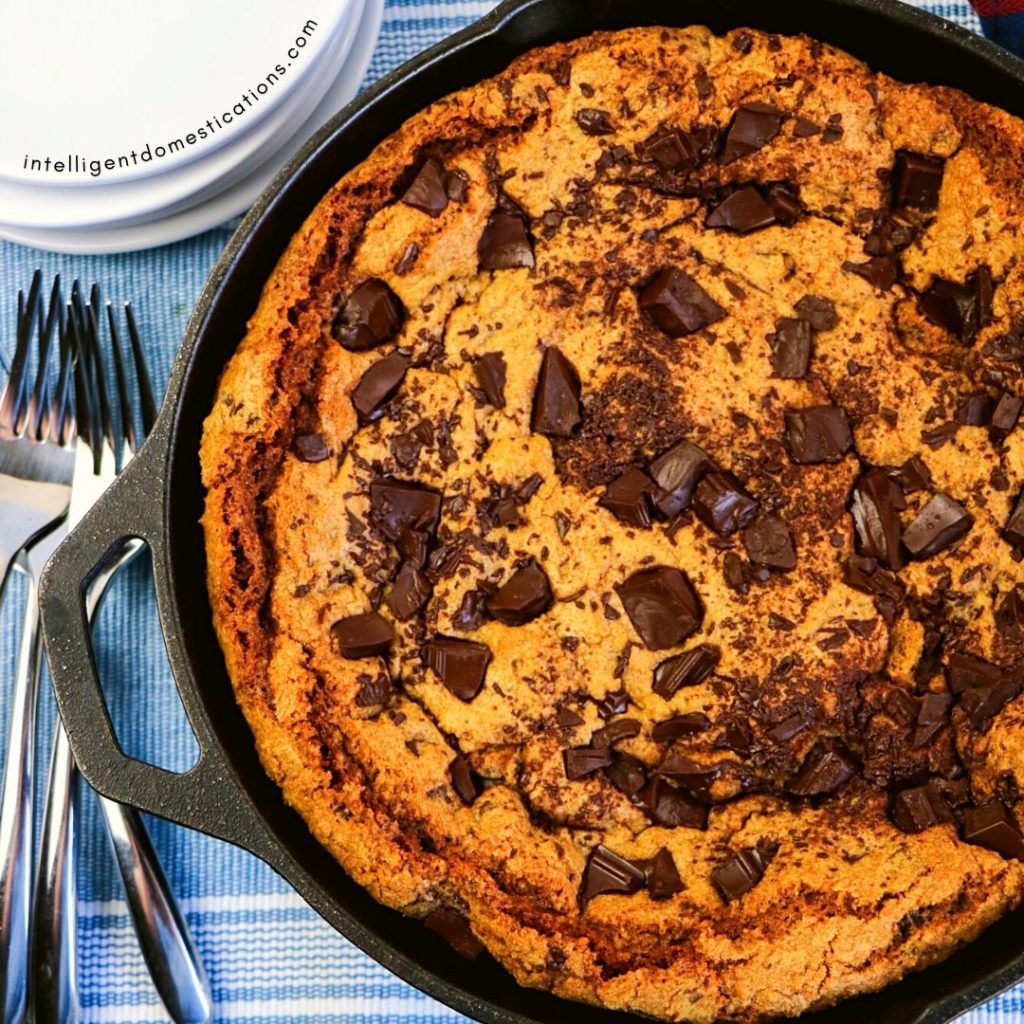 giant chocolate chip cookie in an iron skillet