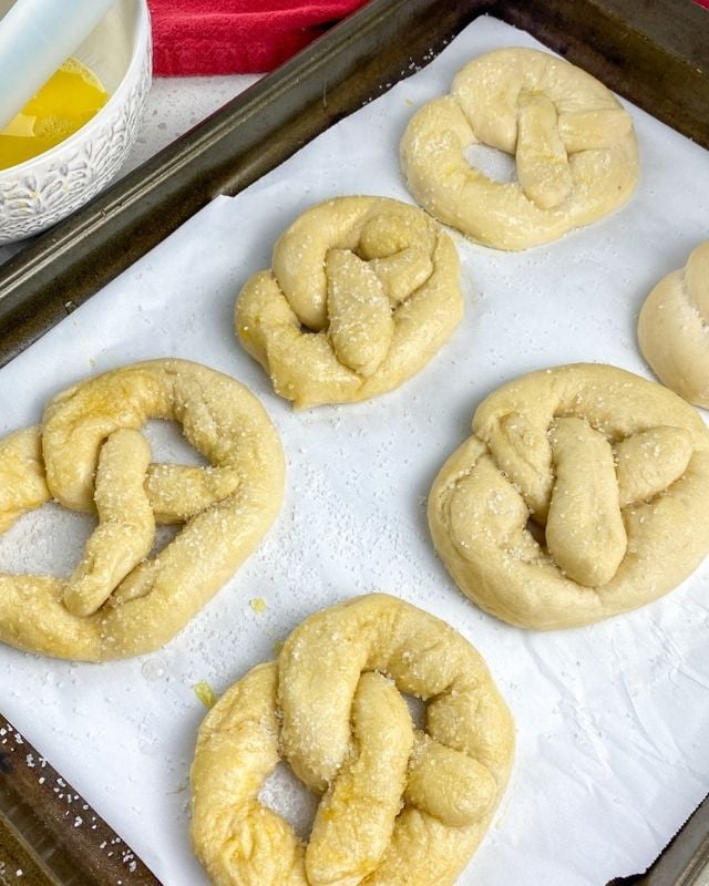 Pretzels basted with egg wash and sprinkled with coarse salt