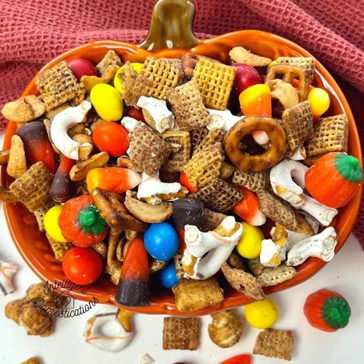 Fall Harvest Chex Mix served in an orange pumpkin shape bowl