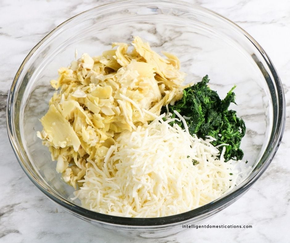 spinach and artichoke dip ingredients in a bowl