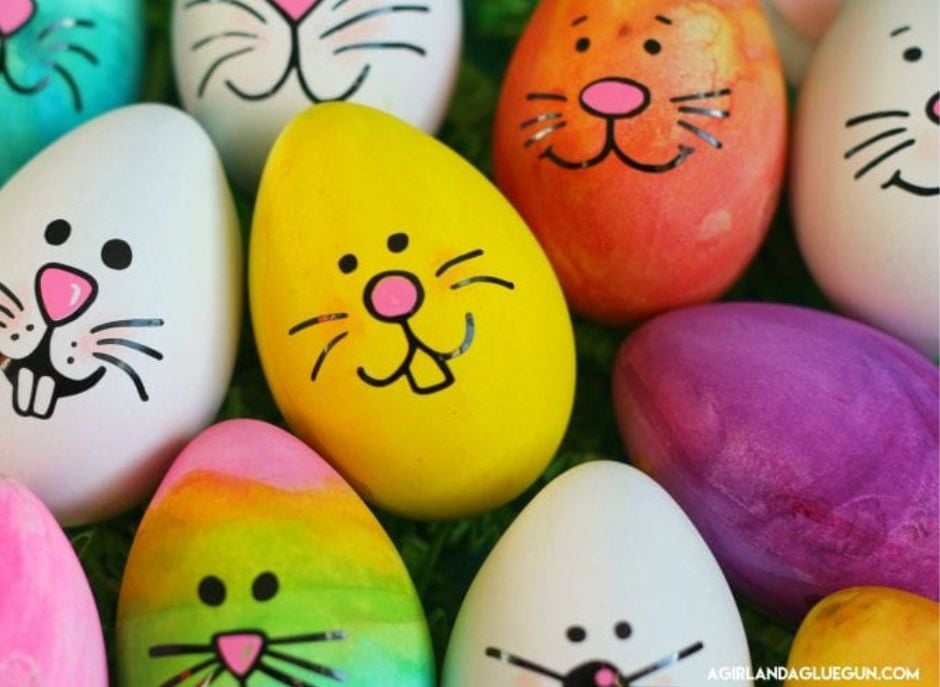Easter eggs decorated using Cricut for bunny faces. a girl and her glue gun