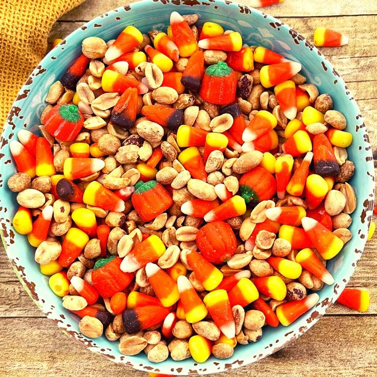 Candy corn and dry roasted peanuts snack mix in a bowl