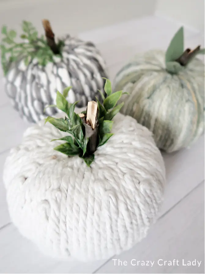 Image for Dollar Tree Mop Pumpkins, an inexpensive yarn pumpkin craft