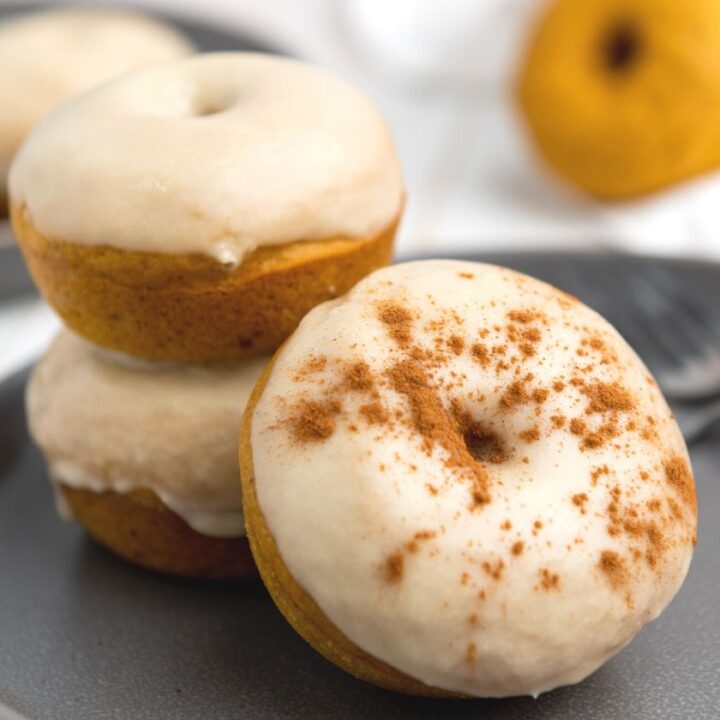 Baked Pumpkin Donuts with maple frosting and dusted with cinnamon