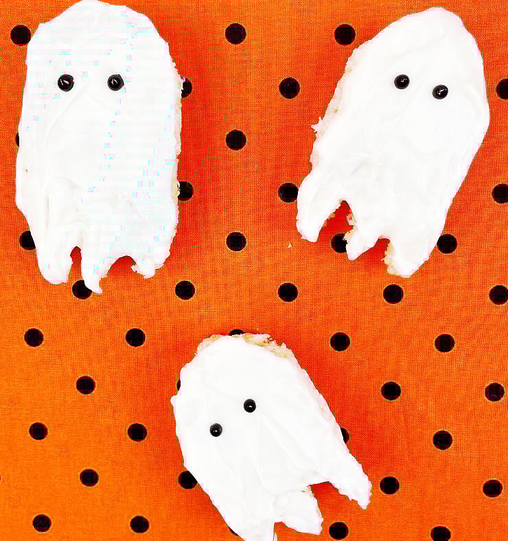 Rice Krispies Treats Ghosts on an orange and black polka dot background
