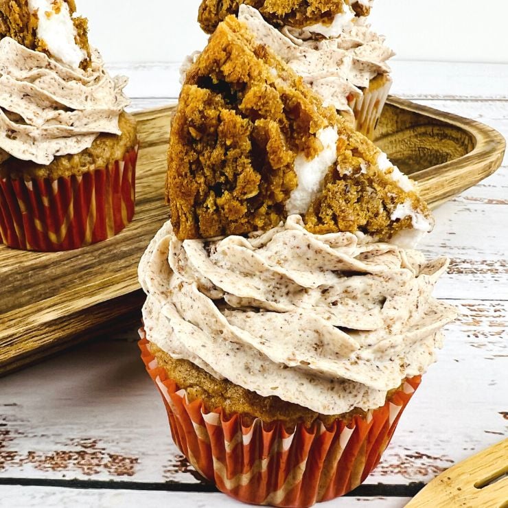 Oatmeal Cream Pie Cupcakes frosted with a wedge of an oatmeal cream pie cookie on top