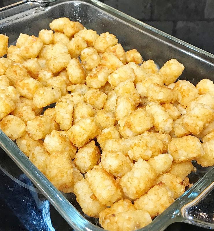 Browned tater tots in a casserole dish