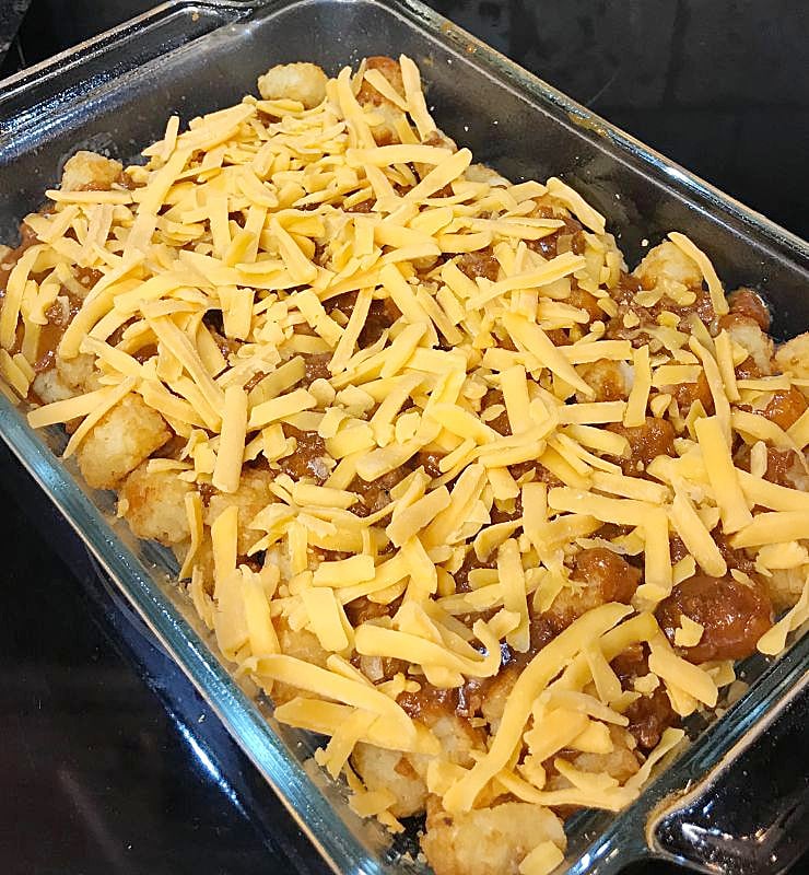 Tater Tots covered with chili and shredded cheese