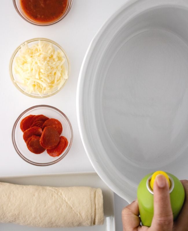 How to make Crockpot pizza. get the Crockpot ready with nonstick spray
