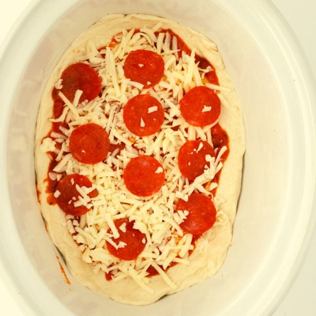 add the pepperoni on top of the cheese
