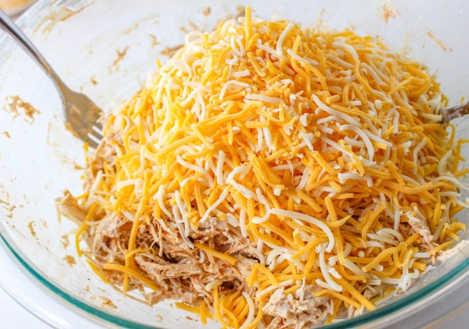 shredded chicken and cheese in a bowl