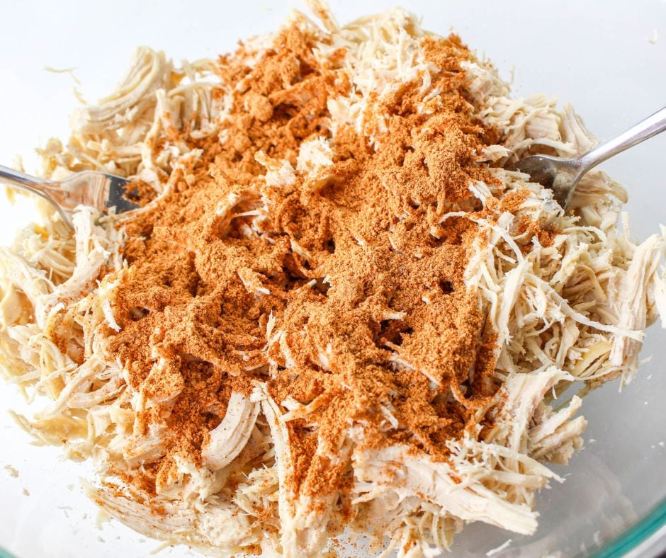 seasoning shredded chicken with taco seasoning