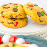 Christmas Chocolate Chip Cookies stacked on a serving plate