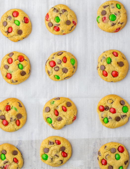 Christmas Chocolate Chip Cookies with Red and Green candies on a baking pan