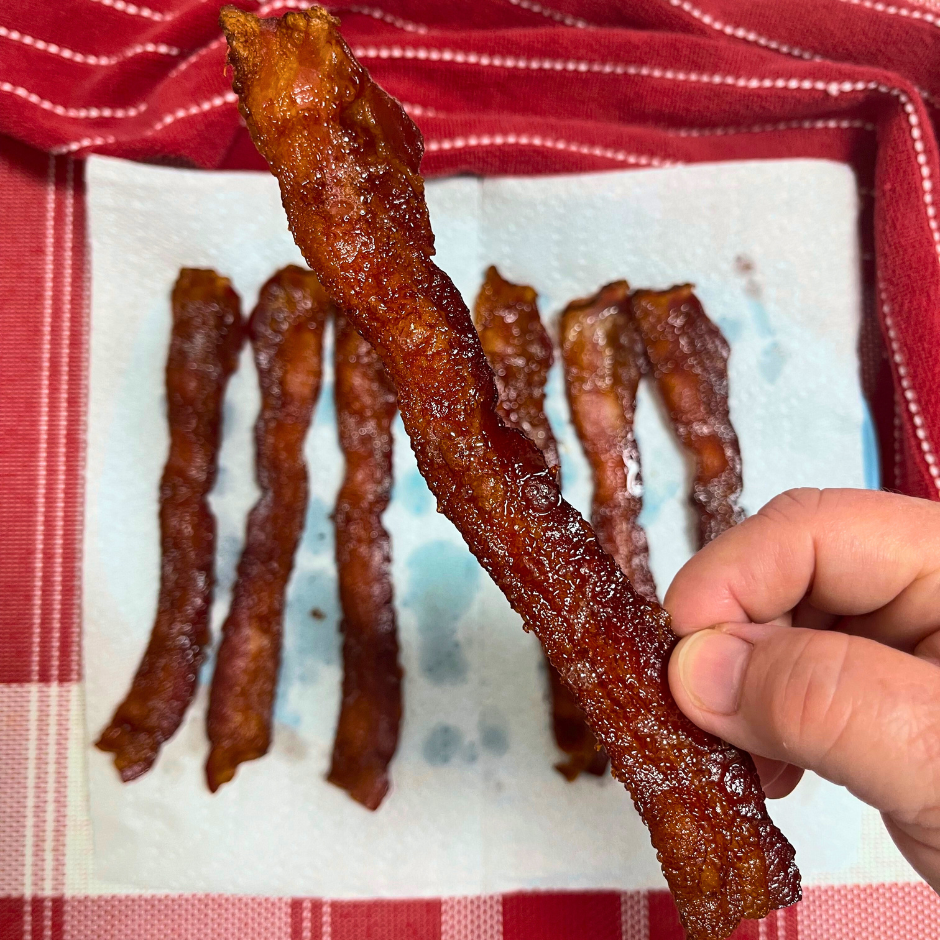 A slice of crisp cooked bacon