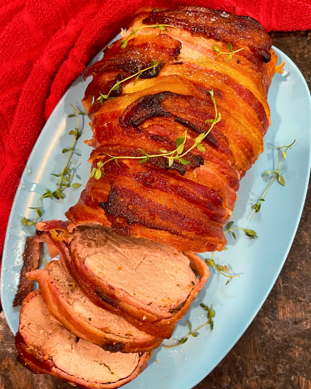 Bacon Wrapped Herb Butter Pork Loin on a serving platter