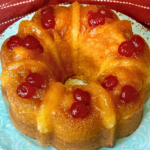 Pineapple Upside Down Bundt cake with pineapple rings and maraschino cherries on top