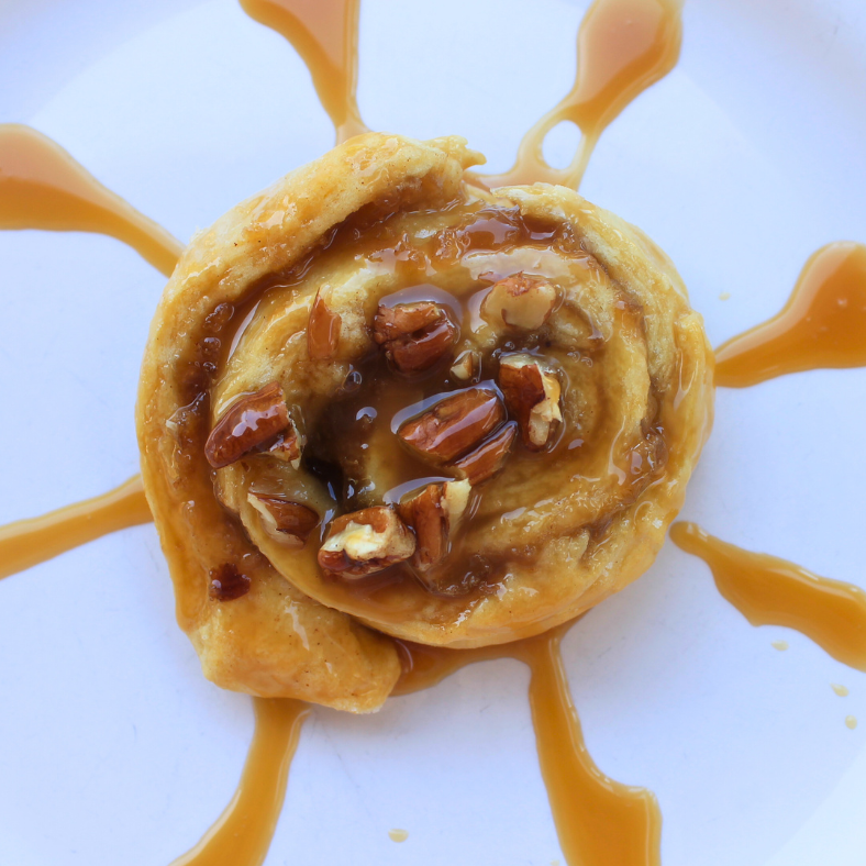 Apple Cinnamon Rolls made with jumbo crescent rolls. Topped with pecans and caramel drizzle.