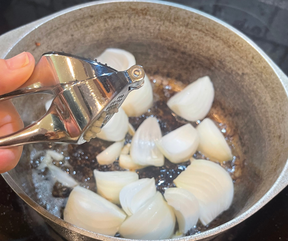 adding onions and garlic